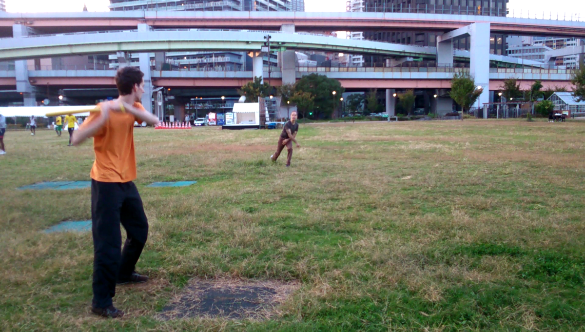 Lukas is batting a Wiffle Ball at Minato no Mori Park