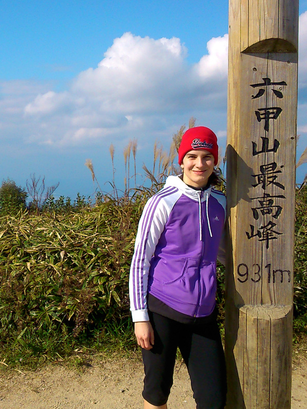 Martina shown next to summit pole